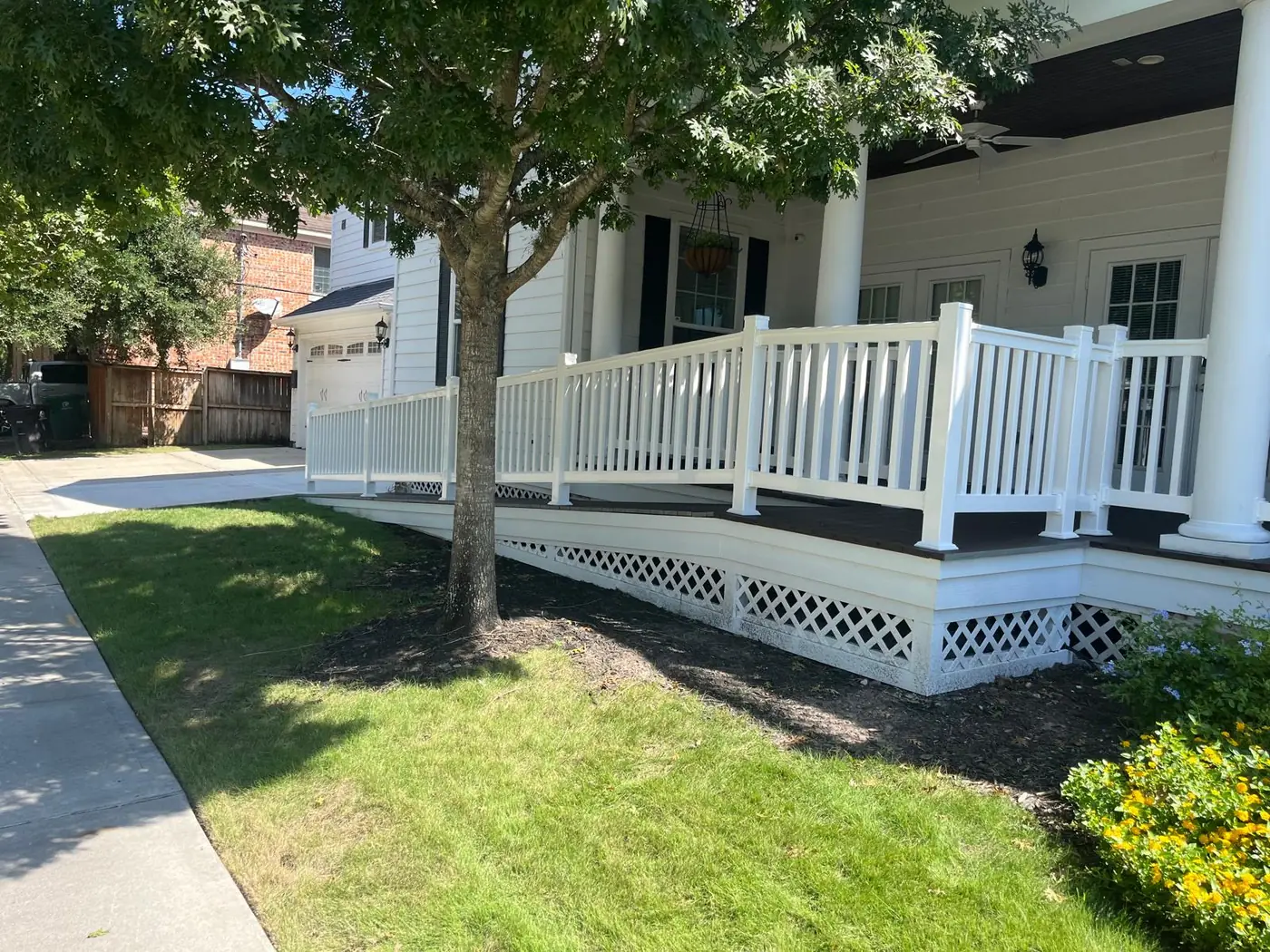 A long railed ramp running from the driveway up to the front porch