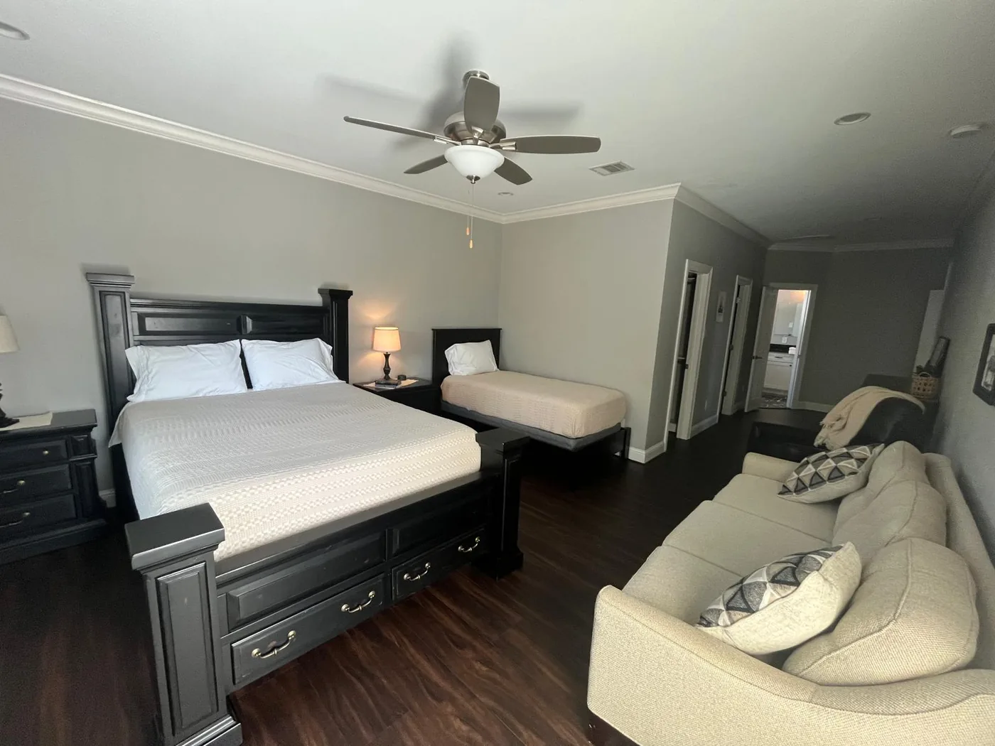 Room 1, with a queen bed, a twin bed, a couch and a recliner